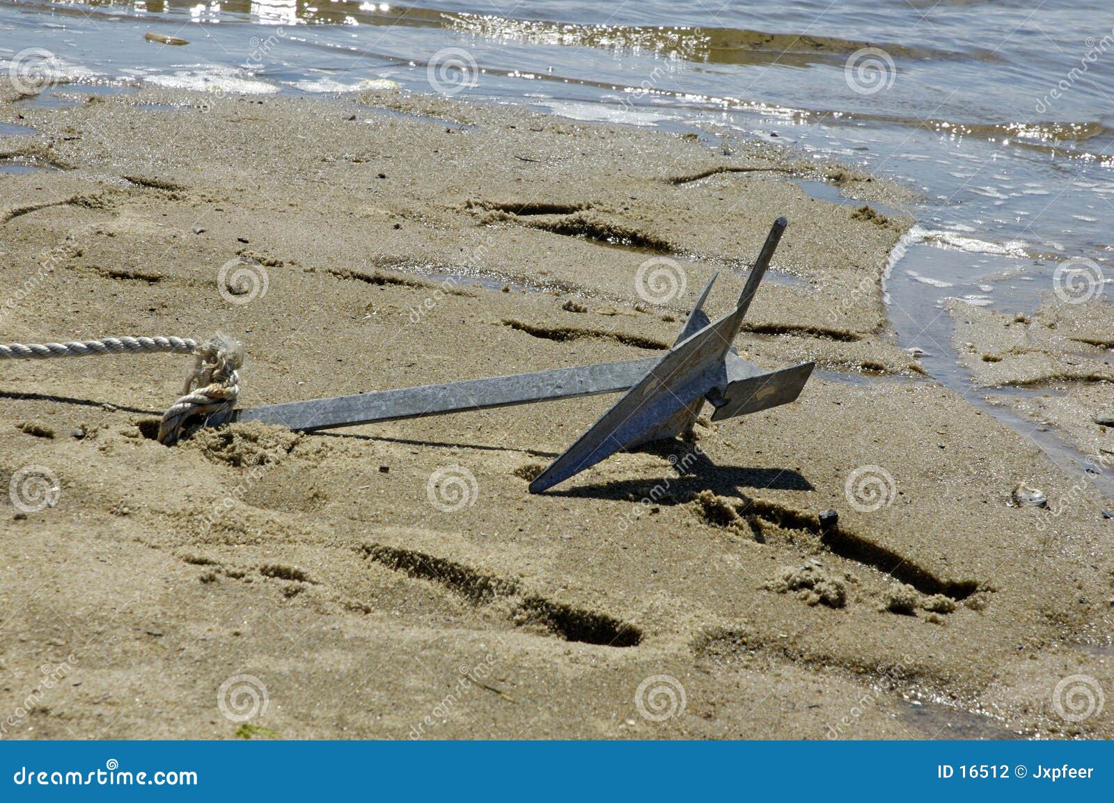 Anchor in the sand stock photo. Image of nautical, beached 16512