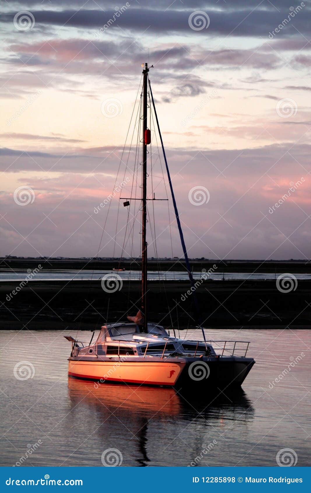 Anchored boat at sunset stock photo. Image of boat, trip 12285898