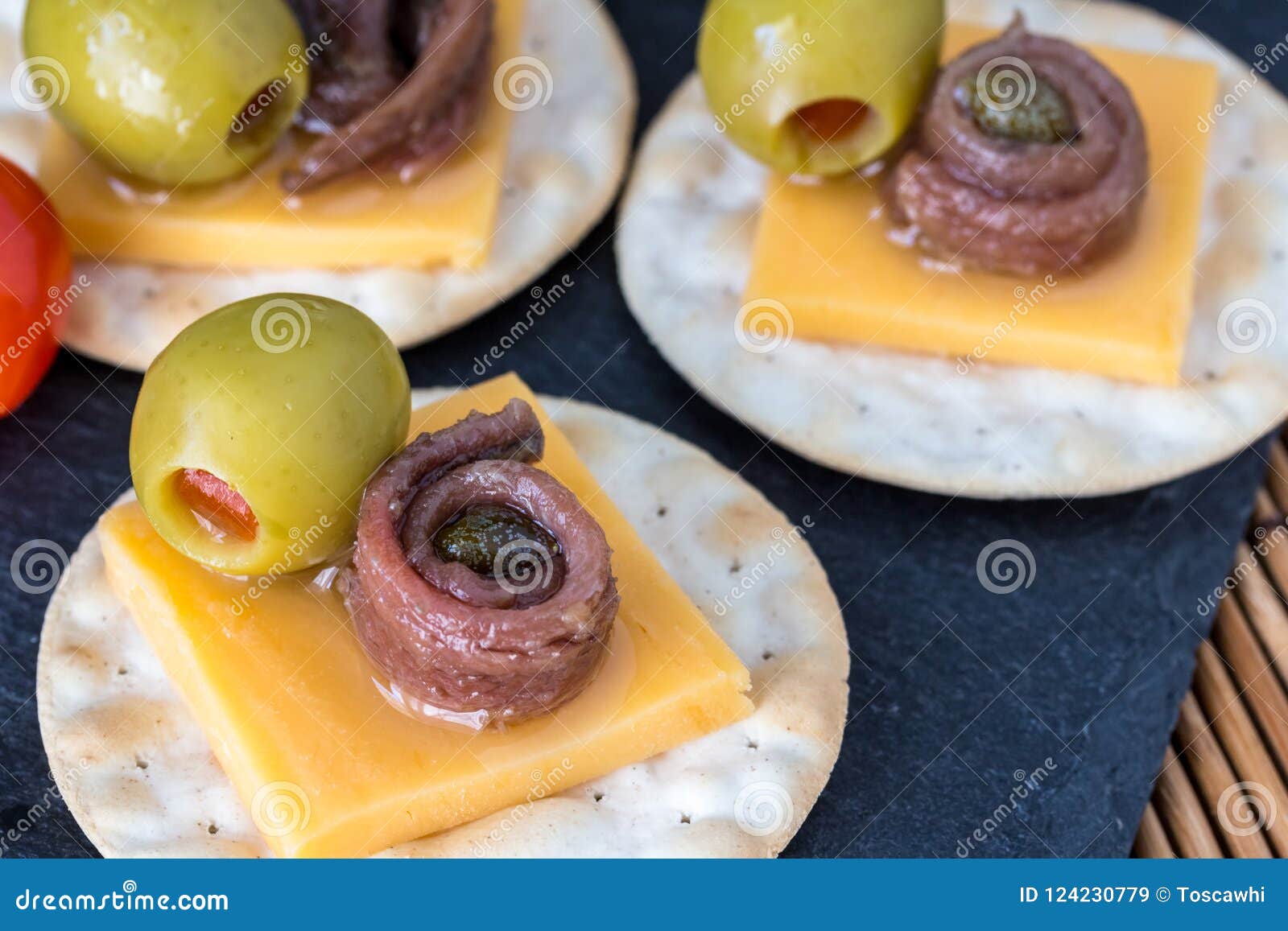 Anchovy On Crackers With Stuffed Olives Appetizer Background W Stock