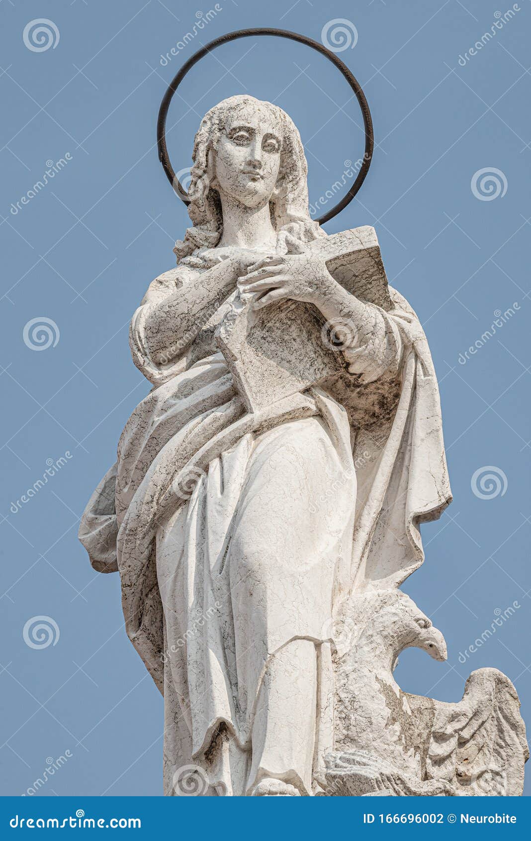 ancient aged sculpture of beautiful holy maria at roof of santa maria assunta jesuits church in venice, italy, details, closeup