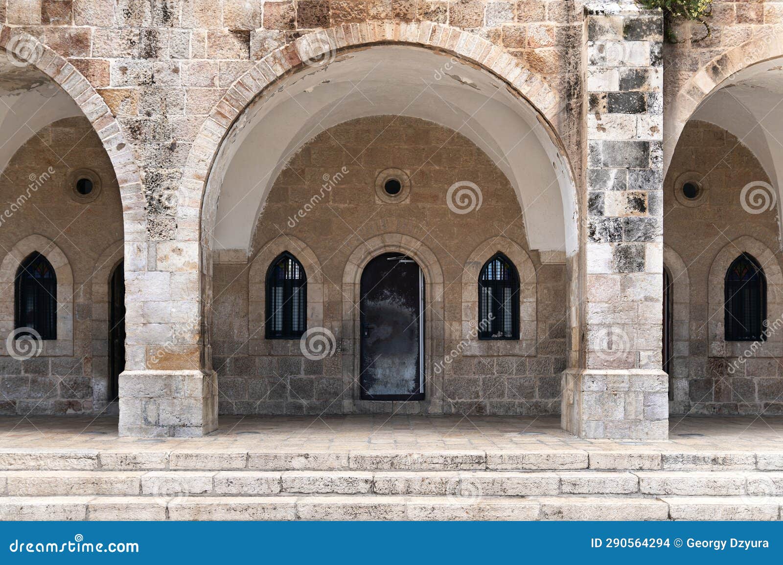 Ancient Building in Jerusalem with Arches and Pillars Stock Photo