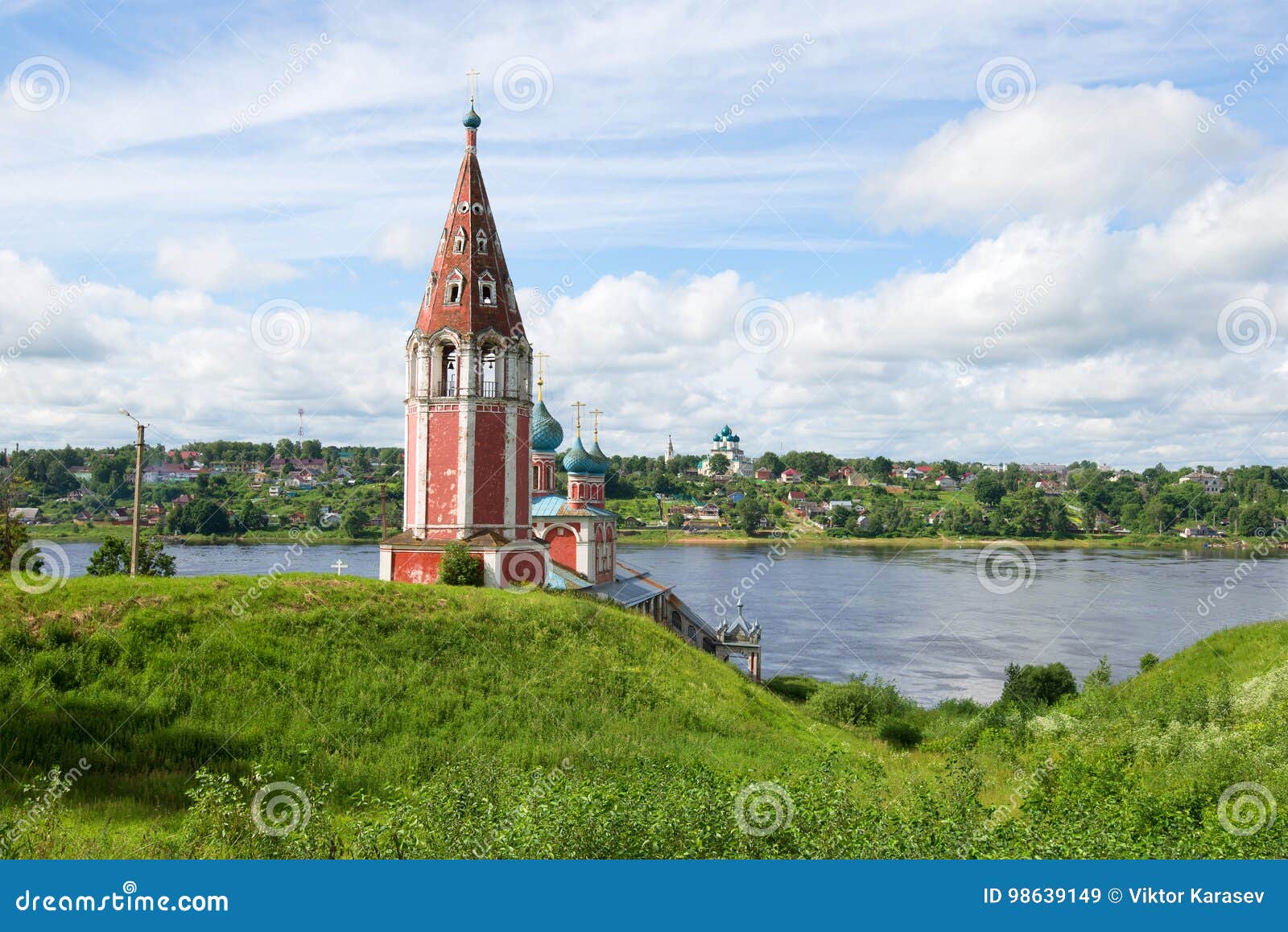 ancient church of the icon of the mother of god kazan against the background of summer volga in the july afternoon. tutaev, russia