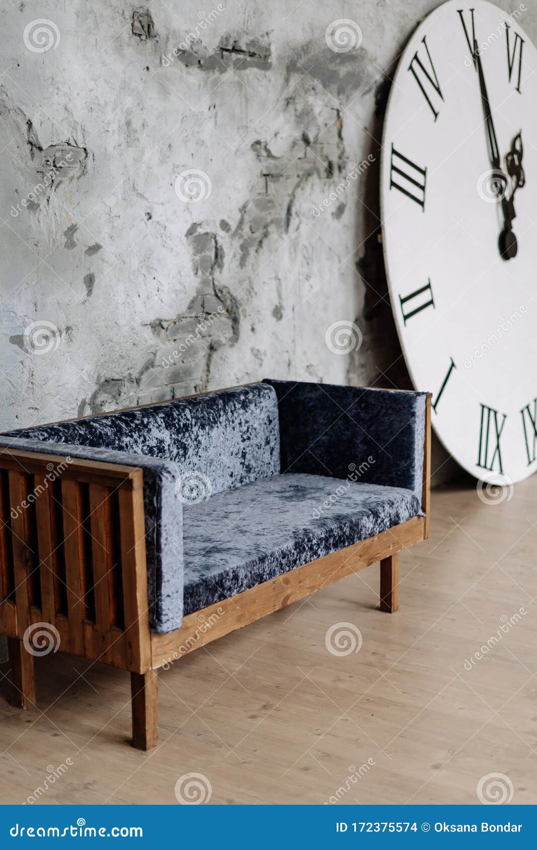 Ancient Couch And Big Clock With Roman Numbers Stock Photo Image