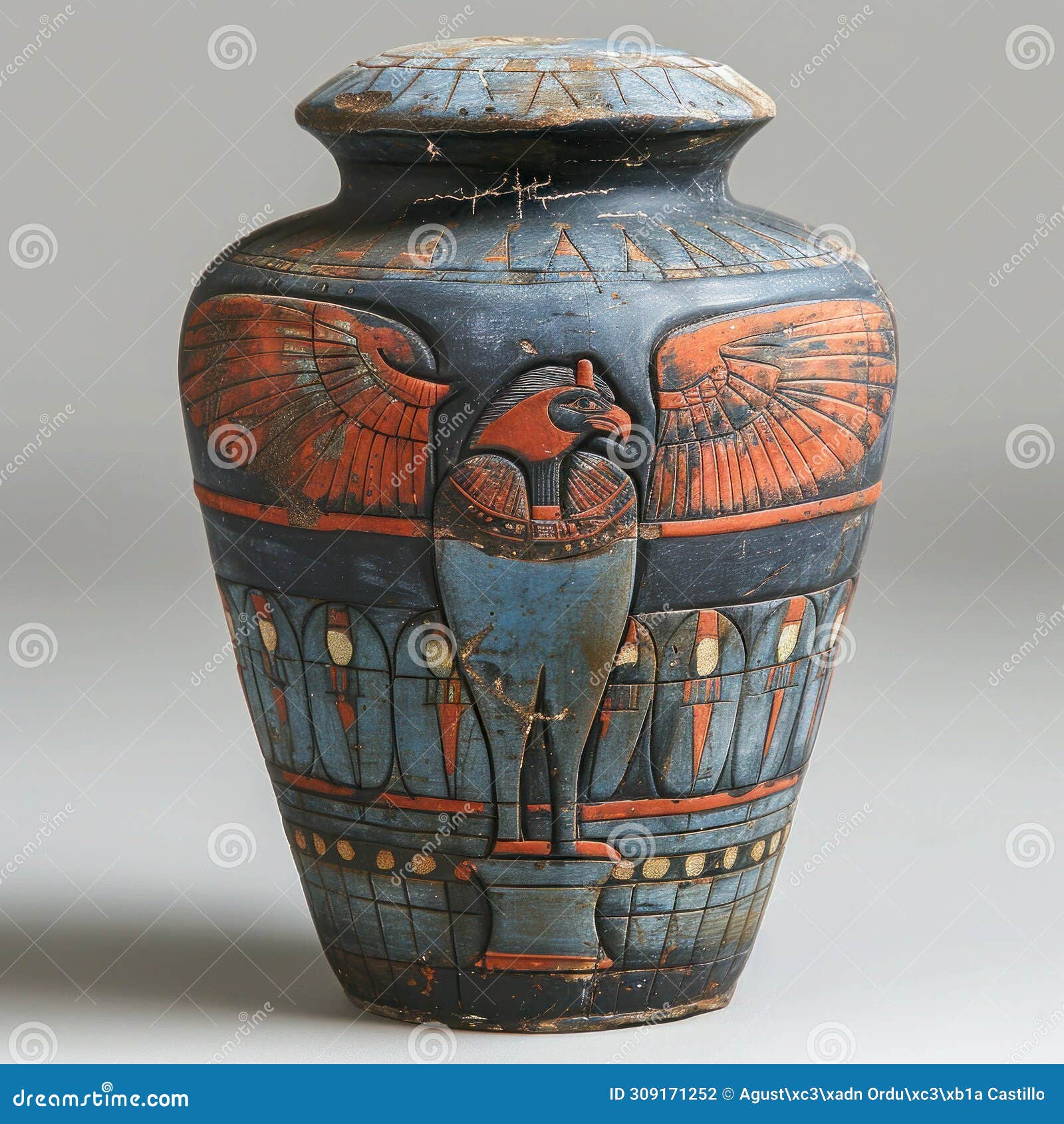 ancient egyptian canopic jar with deity lid