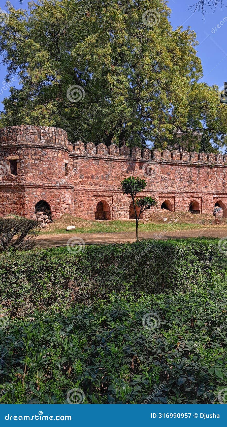 ancient fortress wall, bastion, citadel. ramparts, battlements, arched recesses. mausoleum sikandar lodi tomb, delhi