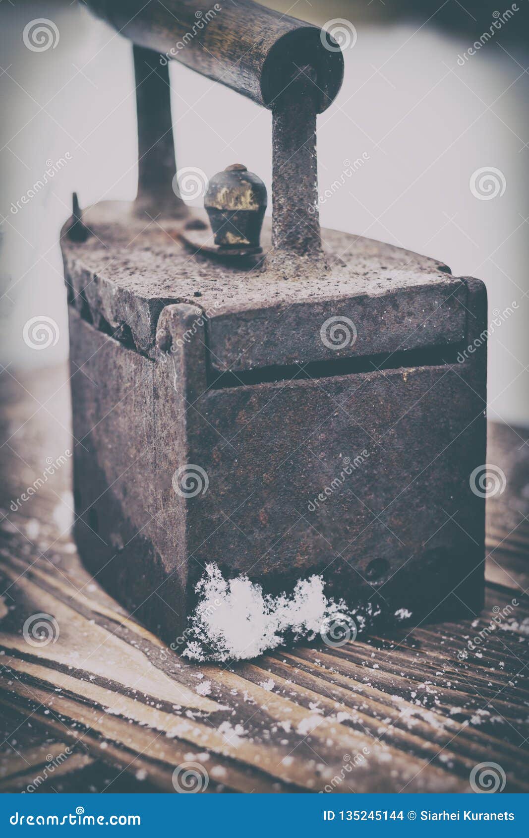 . Ancient Iron Iron for Ironing Coals. Iron. on Wooden Background Stock