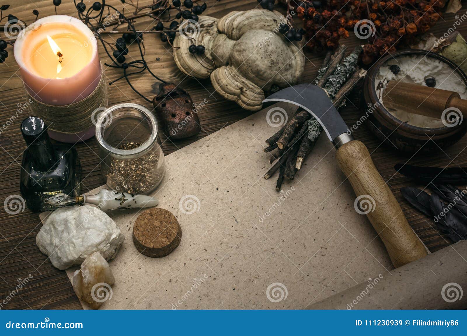 Witchcraft background with copy space. Magic potions and dried herbs on a  witch doctor table. Stock Photo