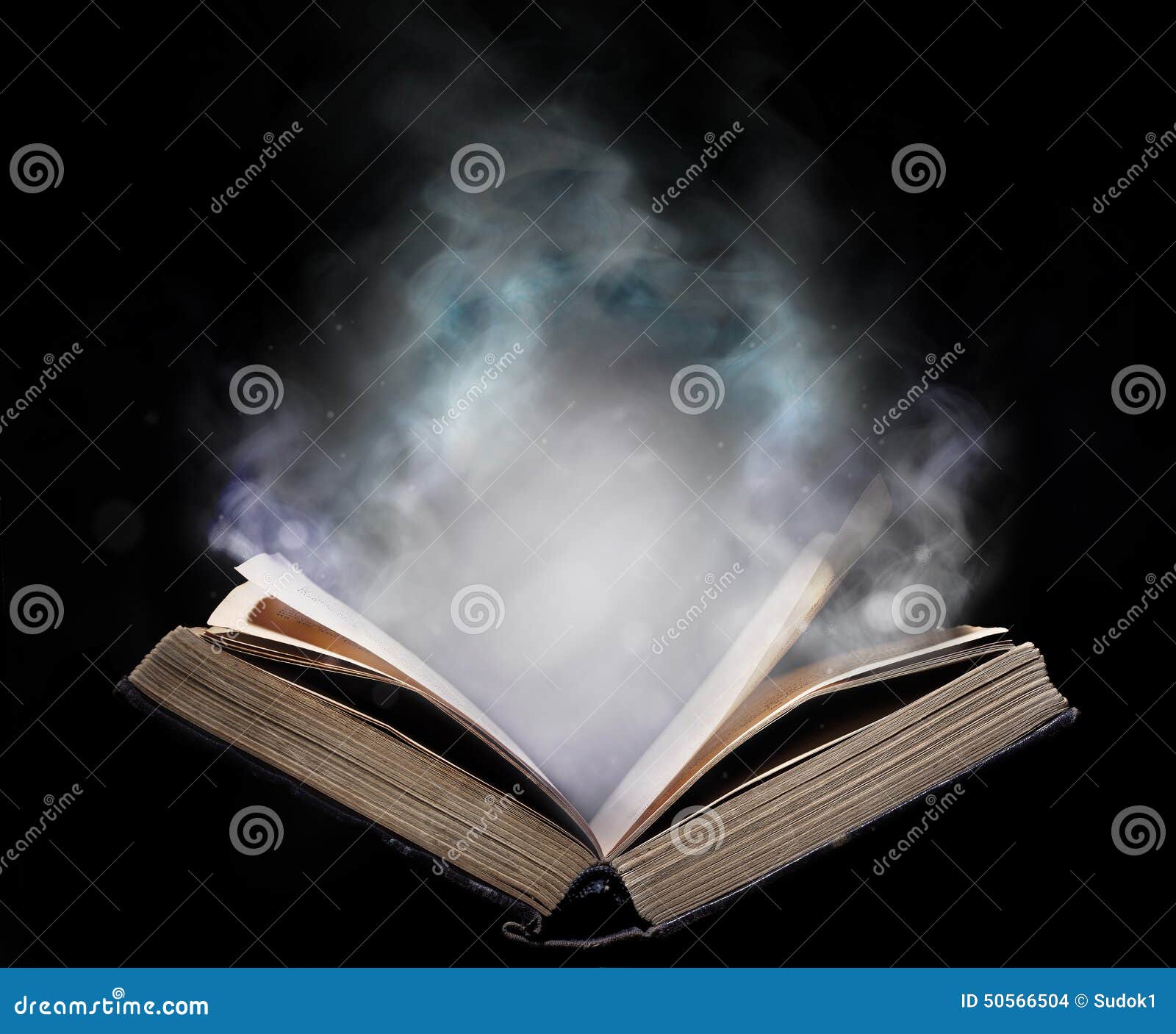 ancient open book in the magical smoke