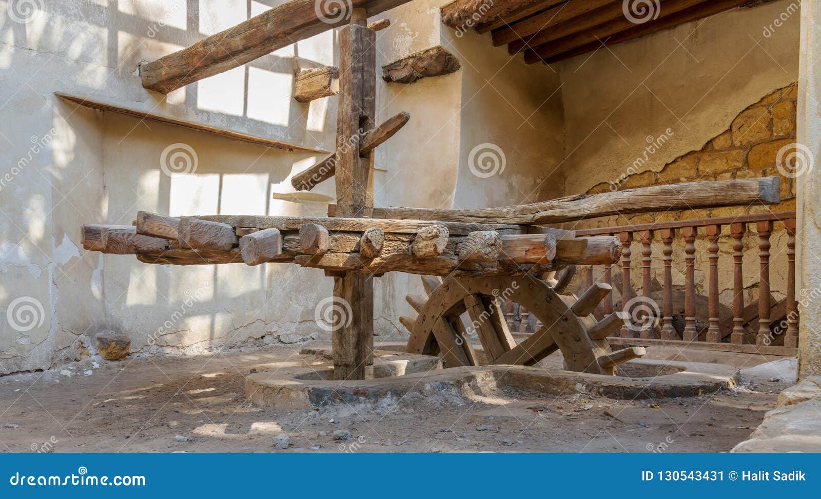 ancient rotary flour mill used to be rotated by animal power in front of el sehemy historic house, cairo, egypt