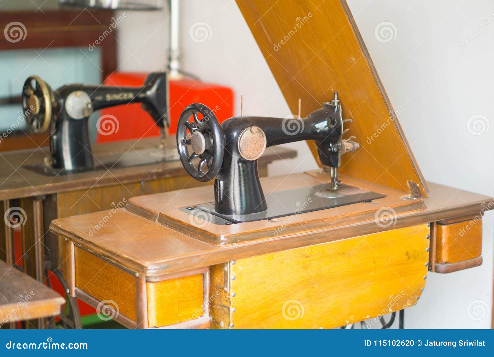 Antique sewing machine in table