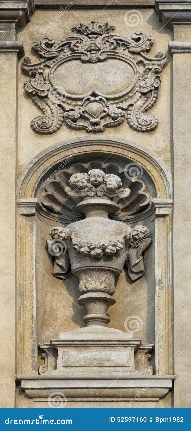 An Ancient Statue in the Wall of the House. Stock Photo Image of