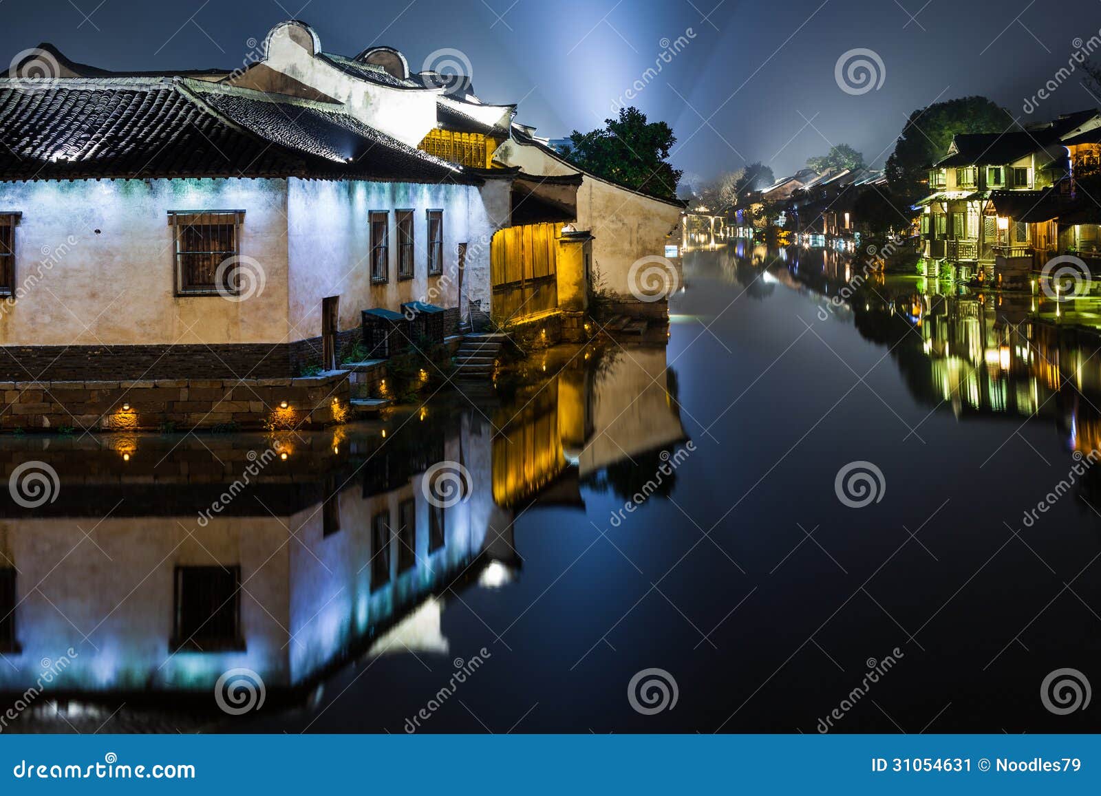 ancient watertown in china at night, wuzhen near shanghai - houses