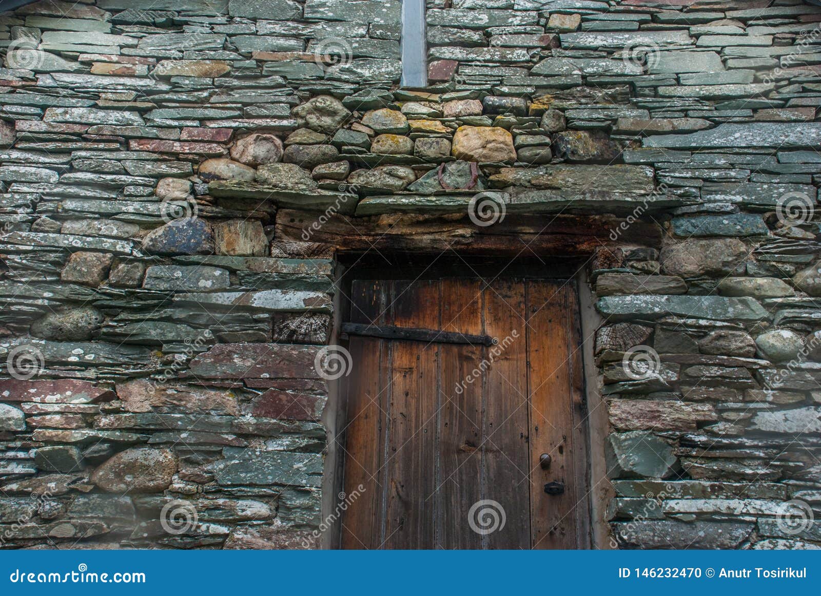 Ancient Wooden Door in Stone Wall Stock Photo - Image of wooden, door ...