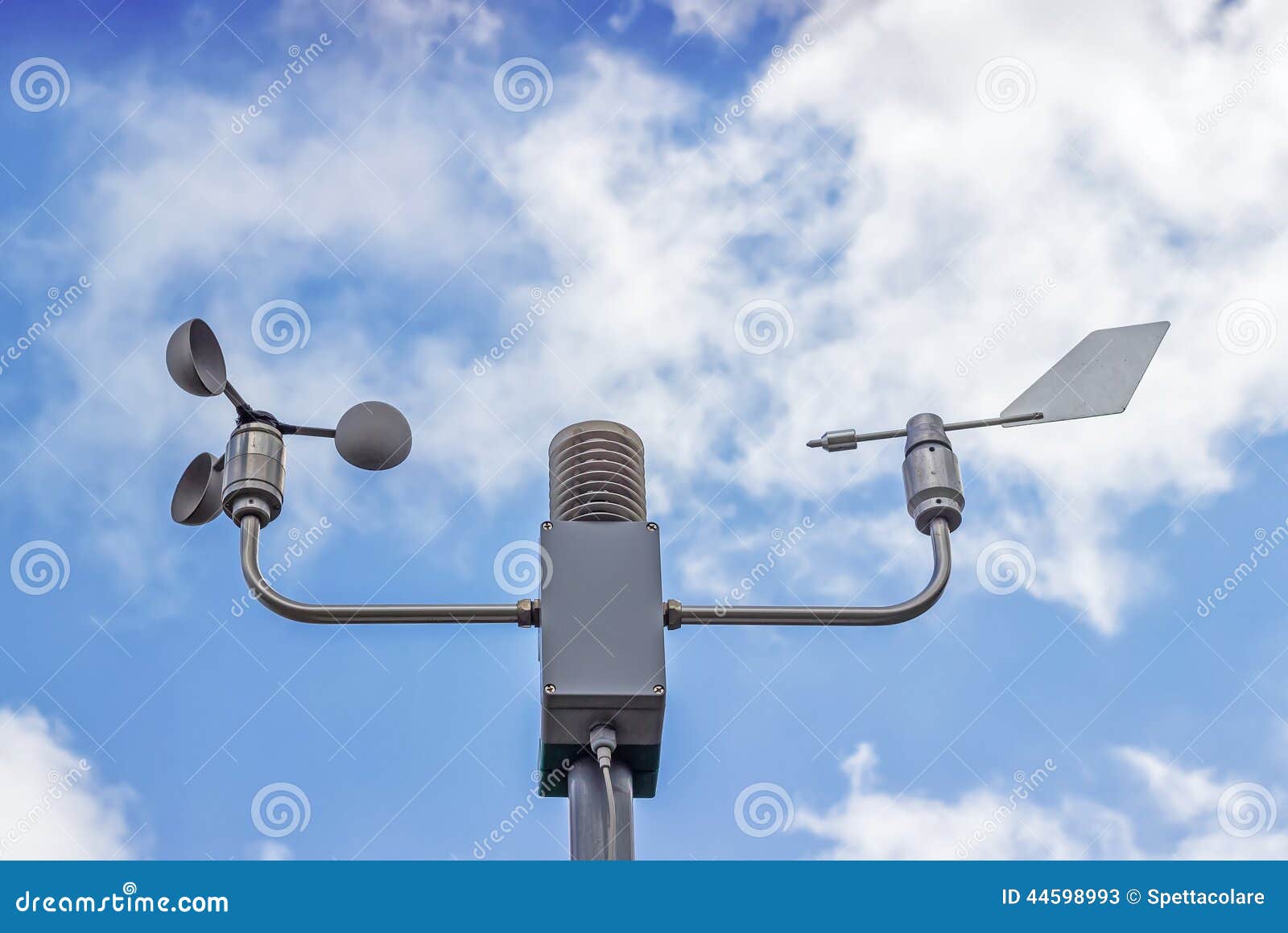 anemometer and wind vane on blue sky