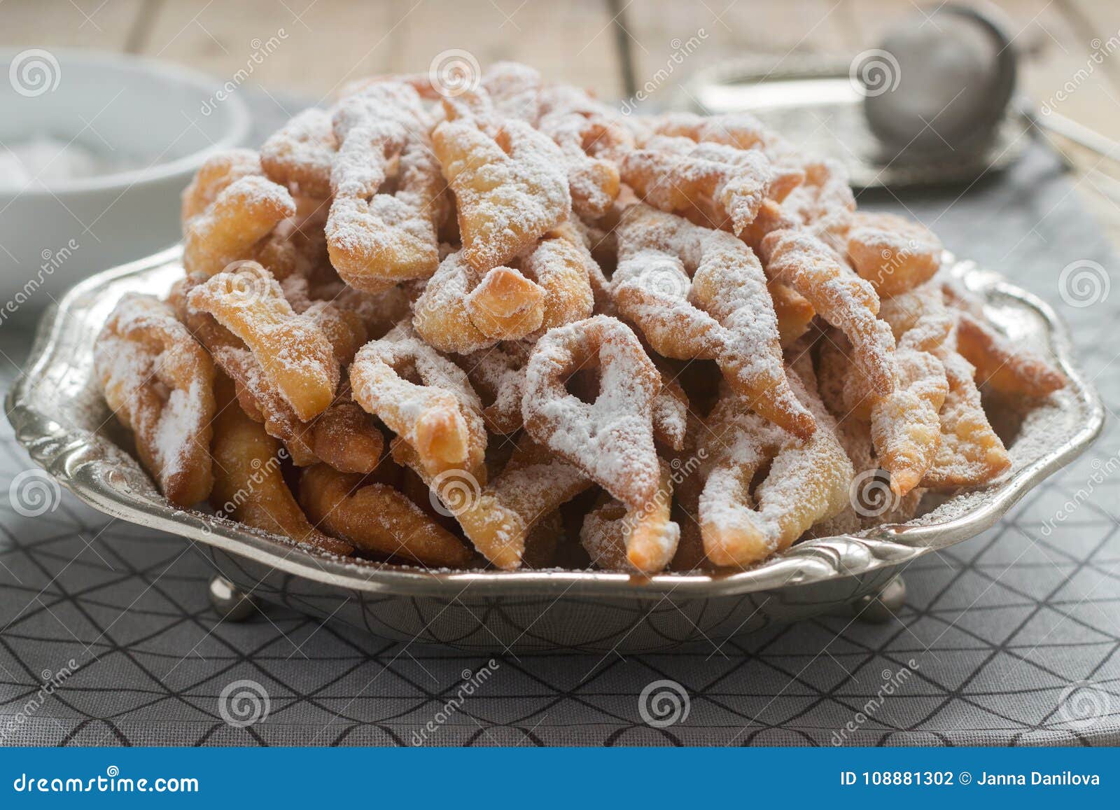 angel wings biscuits, a traditional european sweet dish for carnival. rustic style.