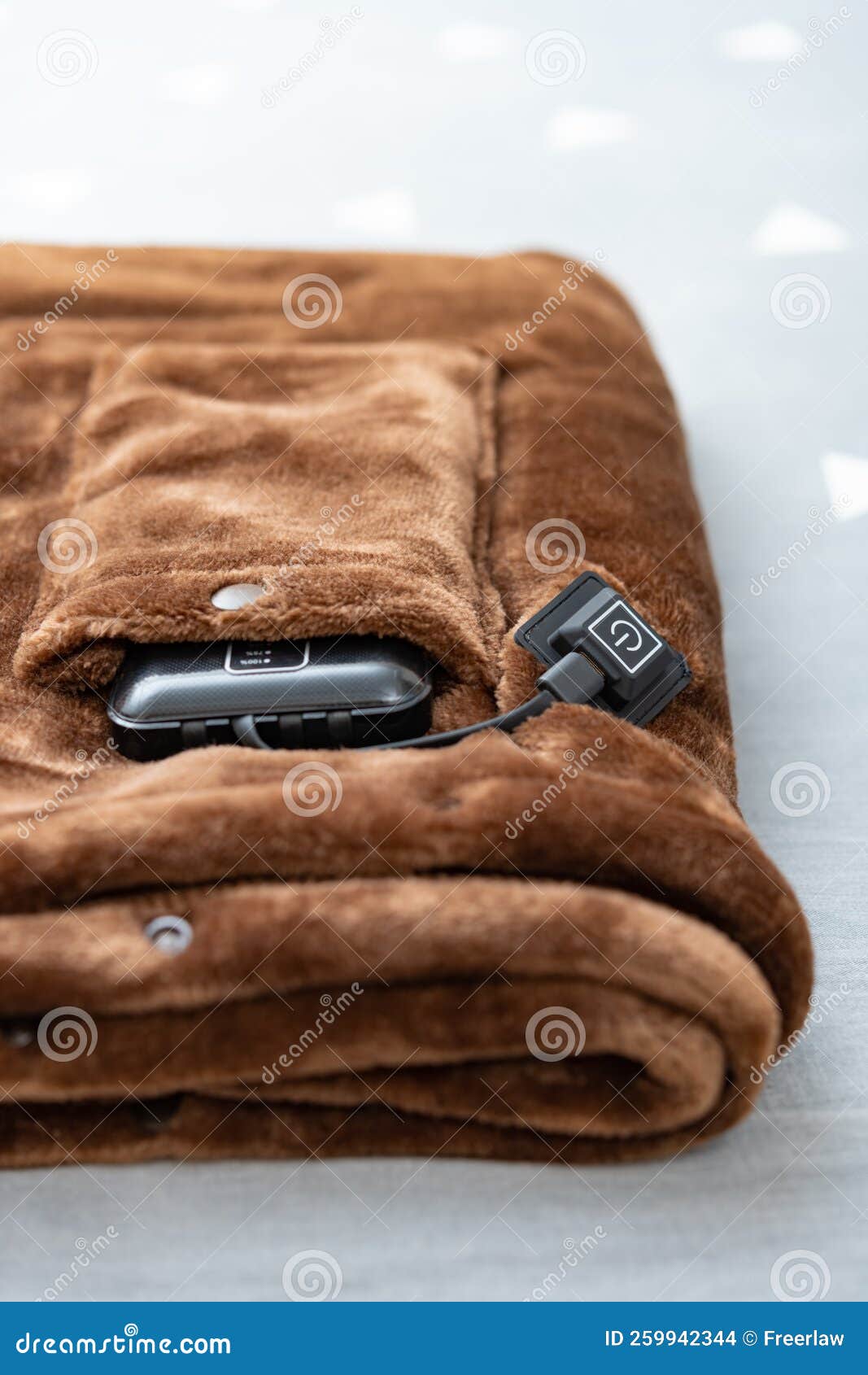 Folded Electric Blanket with Portable Charger As a Power Supply on a