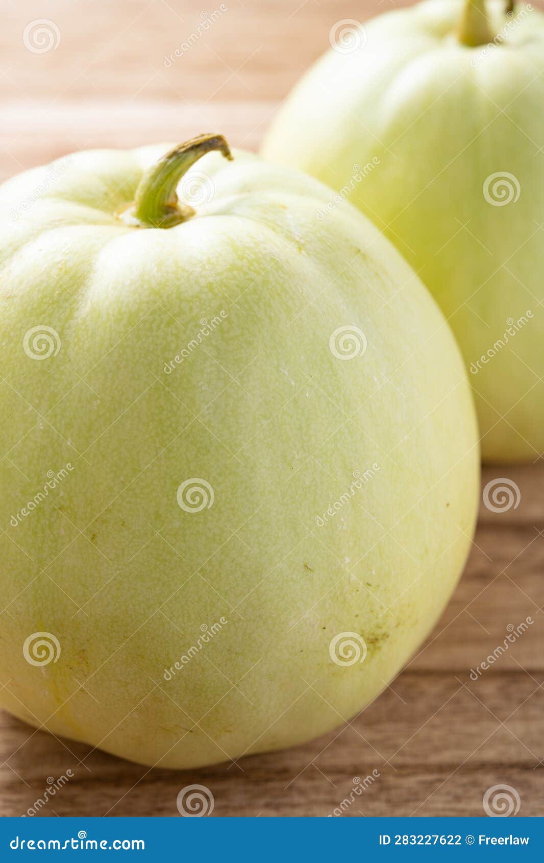 angle view muskmelons on wood background at vertical composition