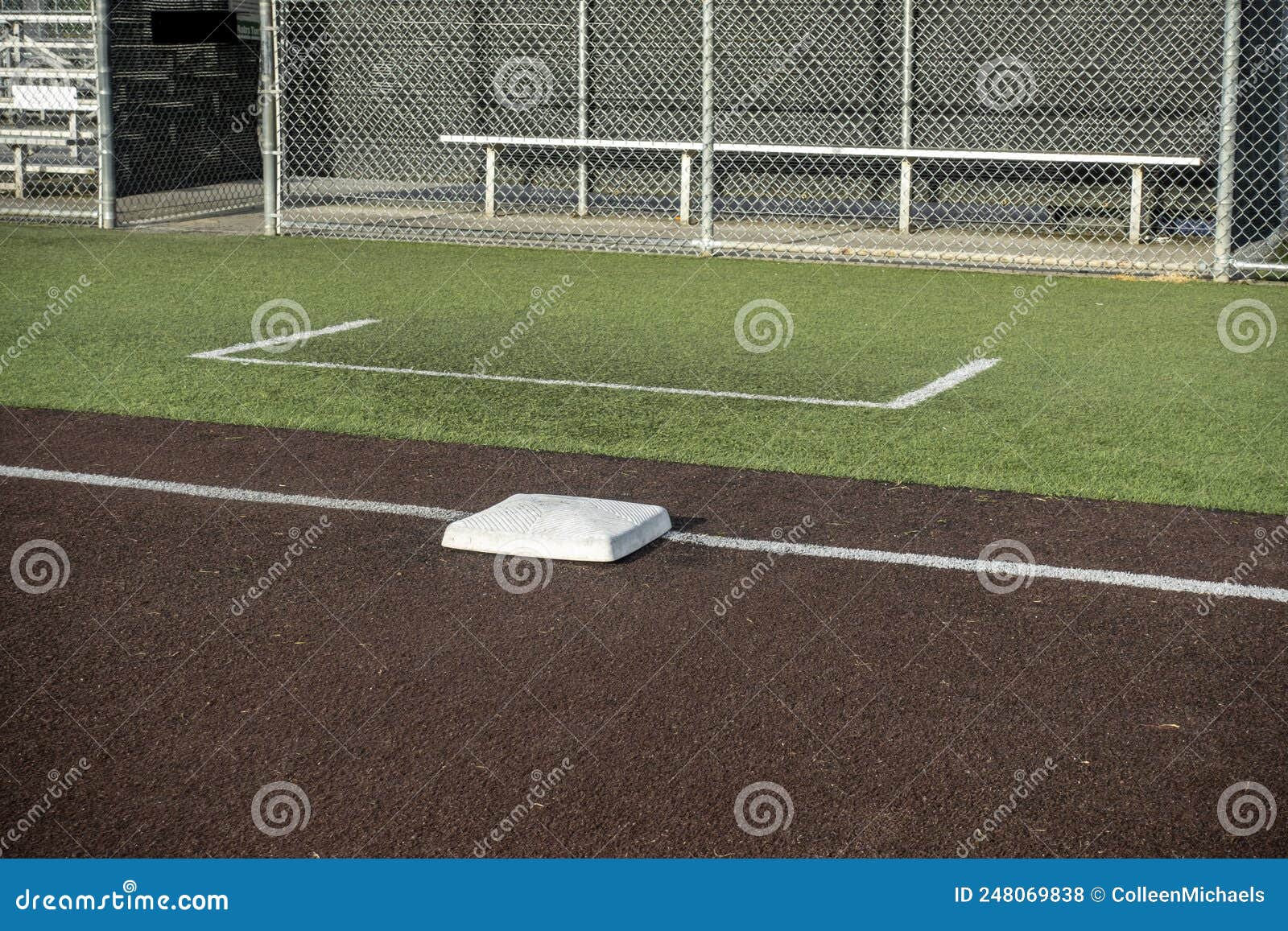 Angled View of a White Base on a Baseball Field, with the View of a