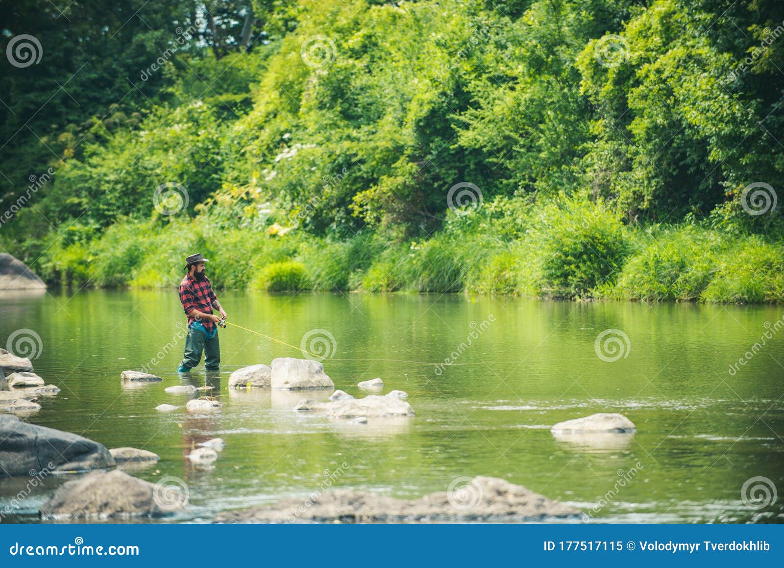 Angler Catching the Fish. Hobby of Real Man. Gone Fishing. Happy