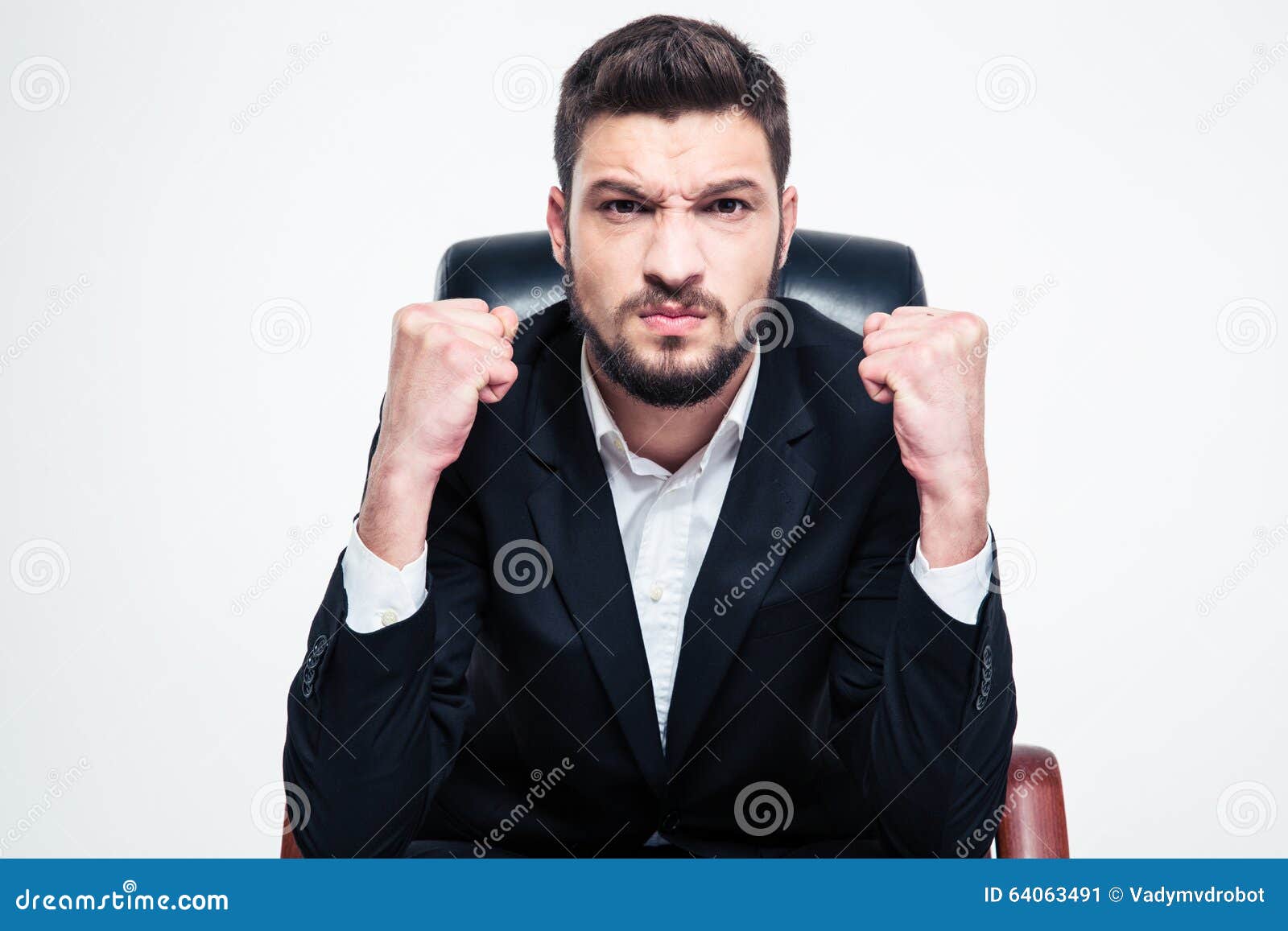 Angry Annoyed Bearded Businessman Sitting And Showing Fists Stock Image