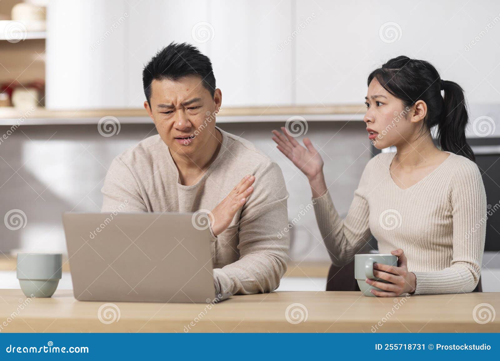 Angry Asian Woman Shouting at Her Husband Using Laptop Stock Image ... pic