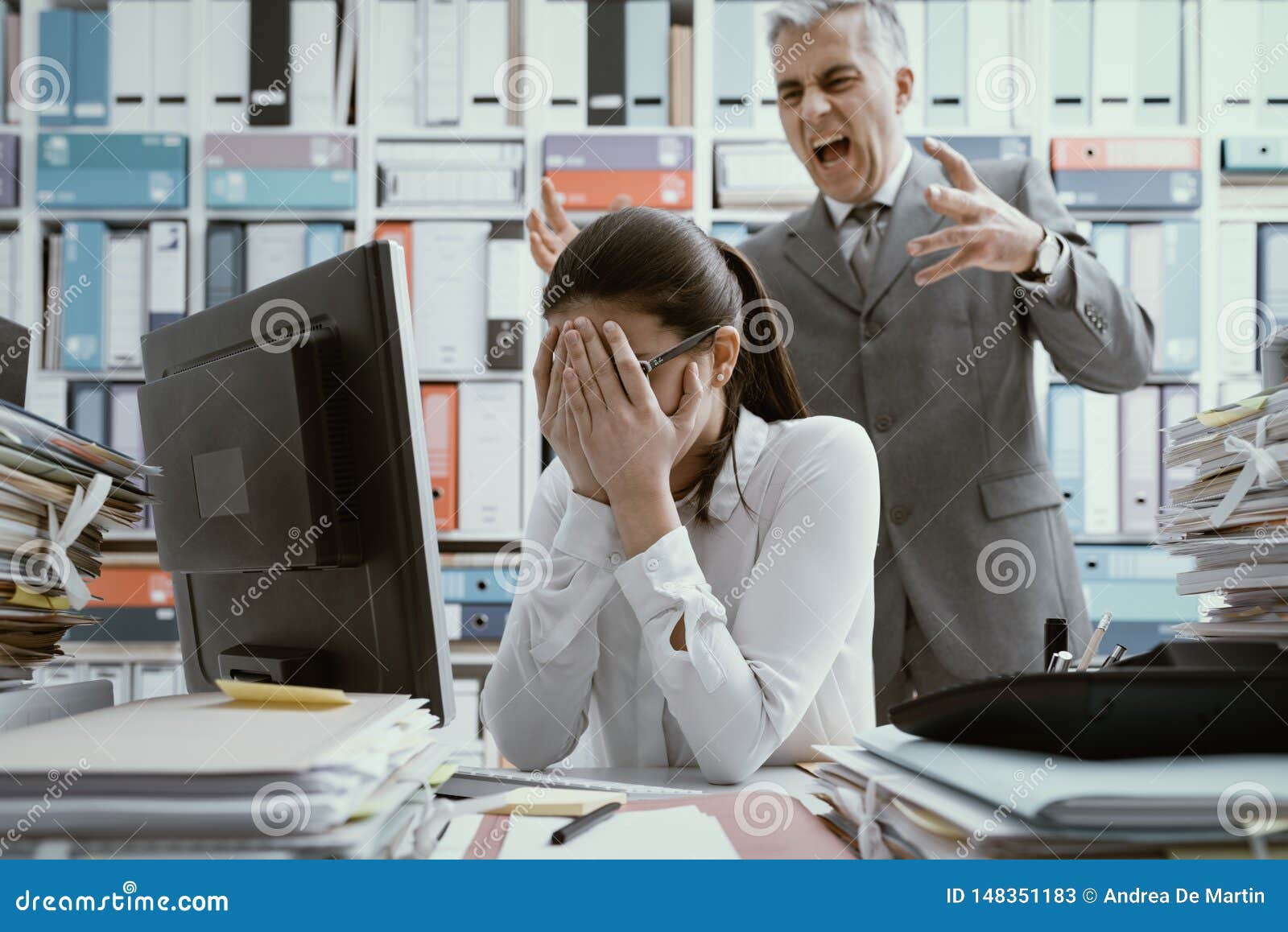 angry boss yelling at his young employee