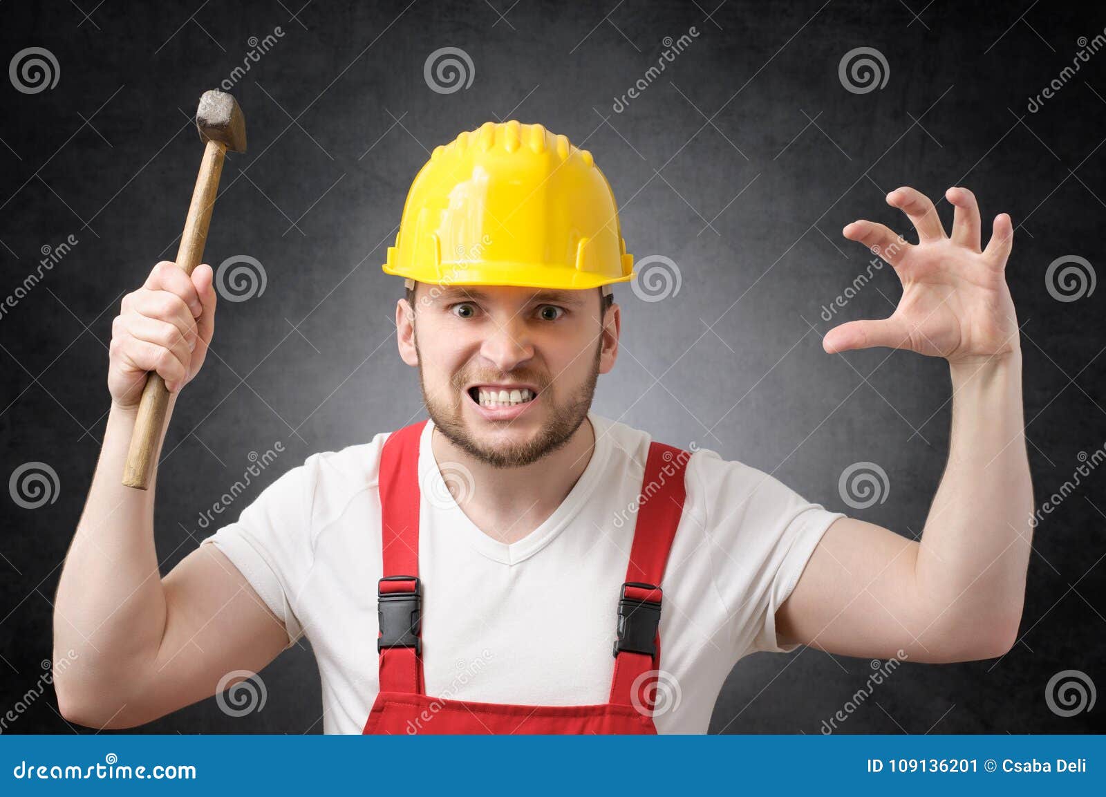 A Worker With A Hammer Repairs The Porch Of A House, A Builder Breaks
