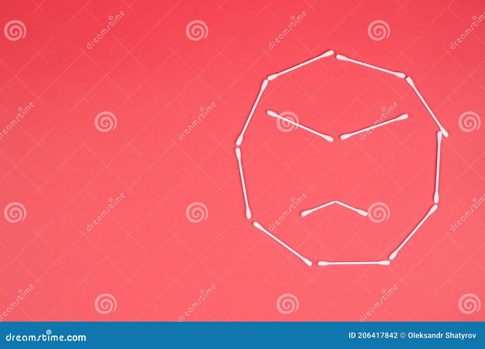 Angry Emoticon Made From Cotton Swabs On Pink Background RoyaltyFree