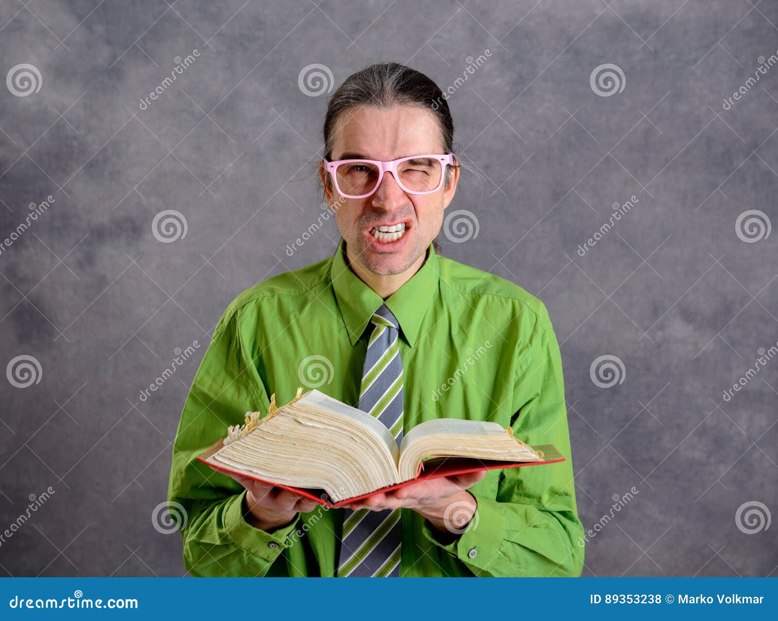 angry lawyer with statute book and pink glasses
