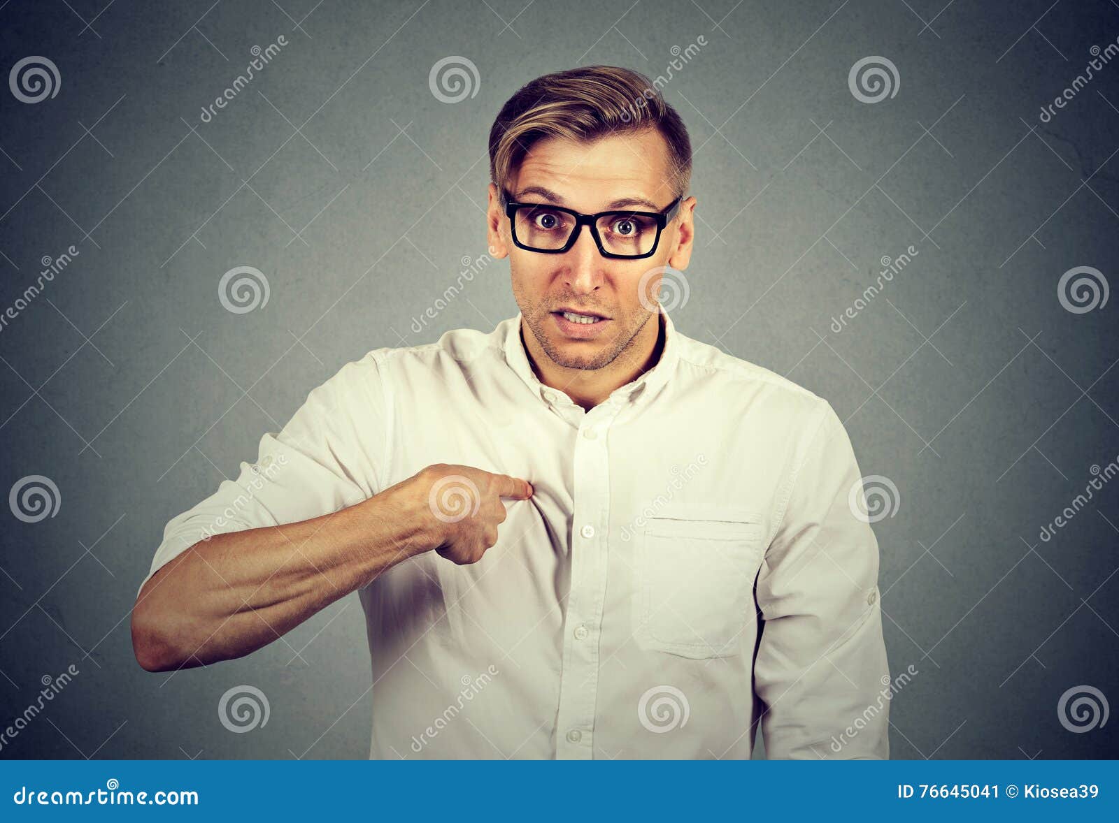 angry, mad, unhappy guy pointing at himself you mean me