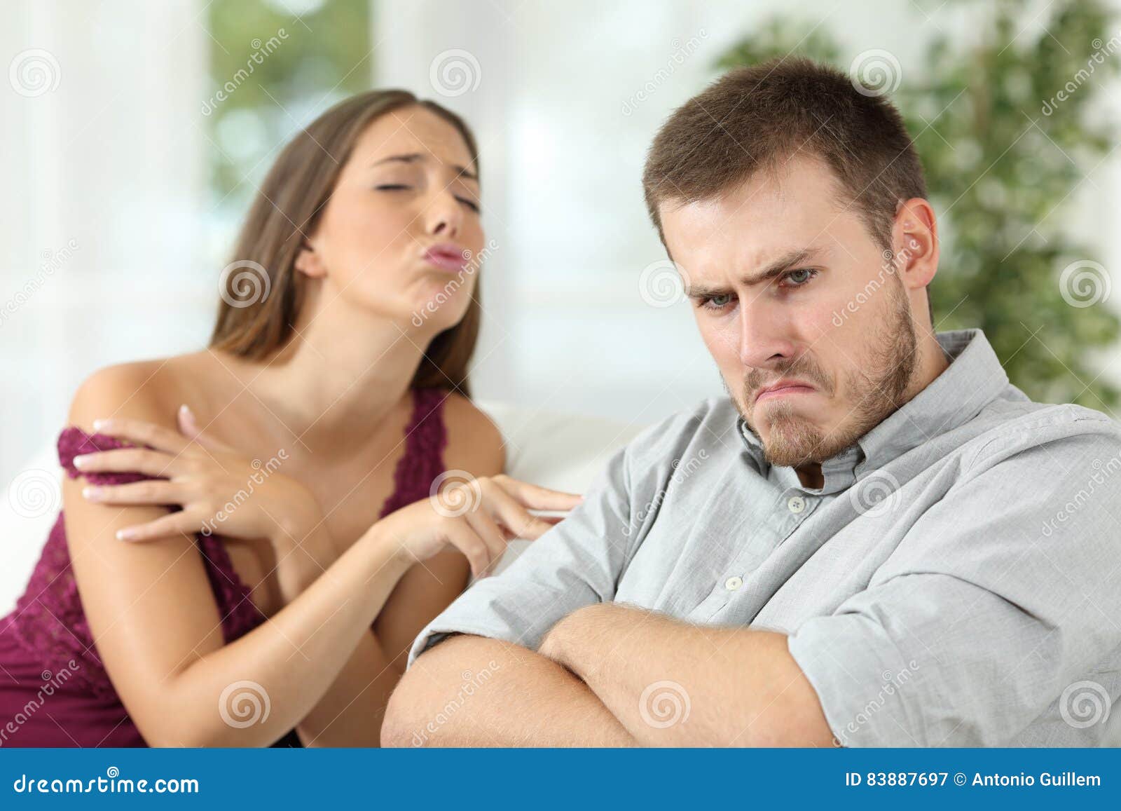Angry Man Rejecting a Sex Offer from His Girlfriend Stock Image picture