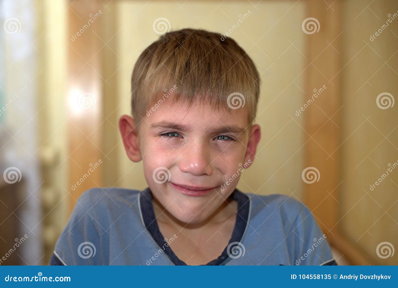 angry, sad and unhappy baby child. shouting and crying. problem child with head in hands. concept for bullying, depression stres
