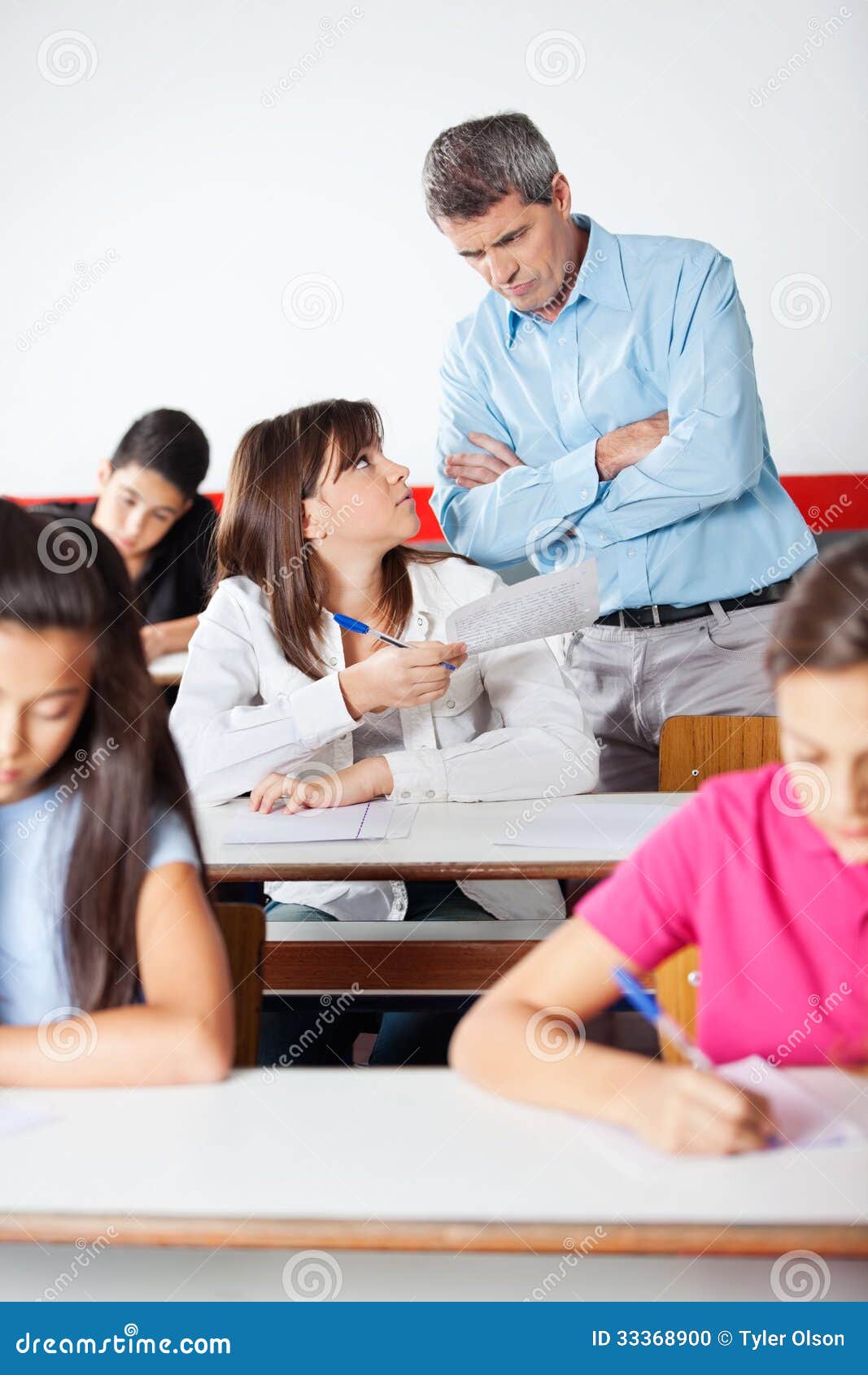 Angry Teacher Looking At Student Stock Photo - Image: 33368900