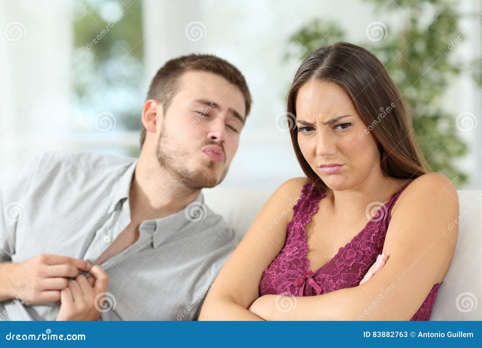 Angry Woman Rejecting a Sex Offer from Her Boyfriend Stock Image picture