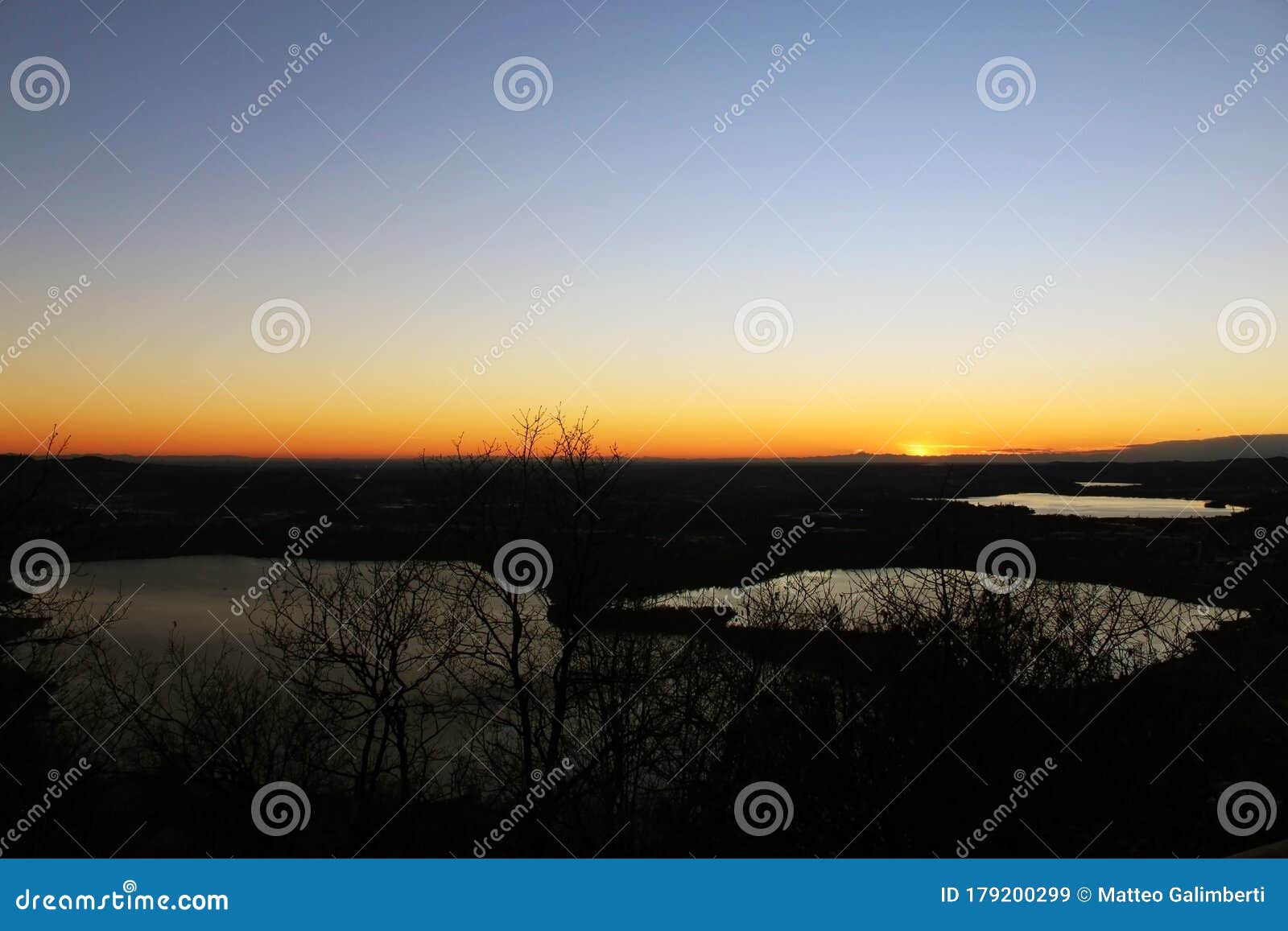 annone lake at sunset from monte barro during a clear sky autumn night