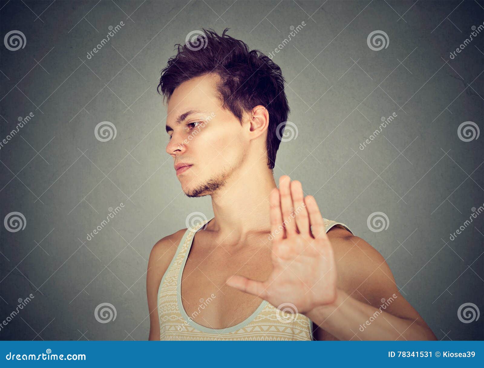 annoyed angry man with bad attitude giving talk to hand gesture
