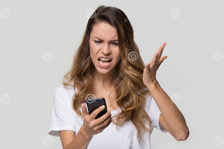 Annoyed Angry Woman Mad About Stuck Phone Isolated On Background Stock Image Image Of 