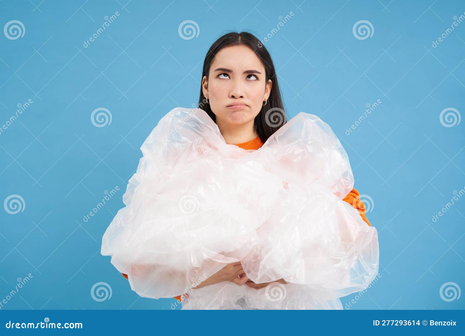 Annoyed Woman Holding Loads of Plastic in Hands, Looking Bothered with ...