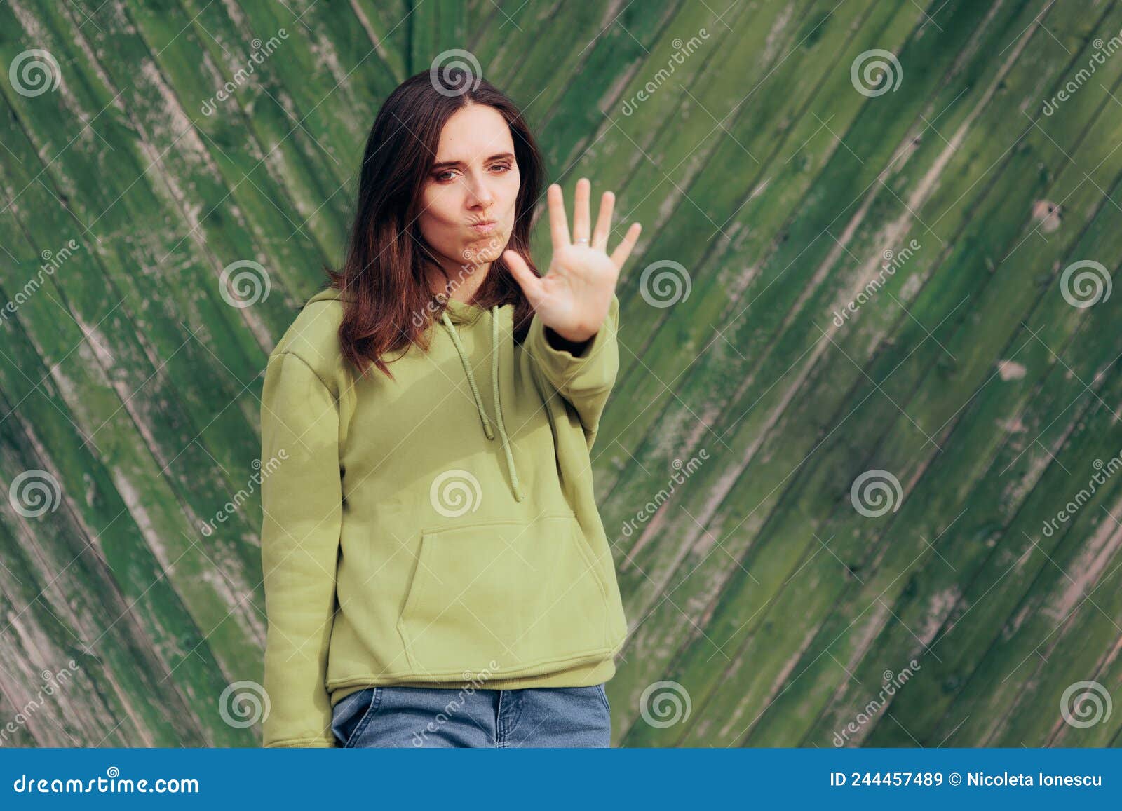 annoyed woman making stop hand gesture