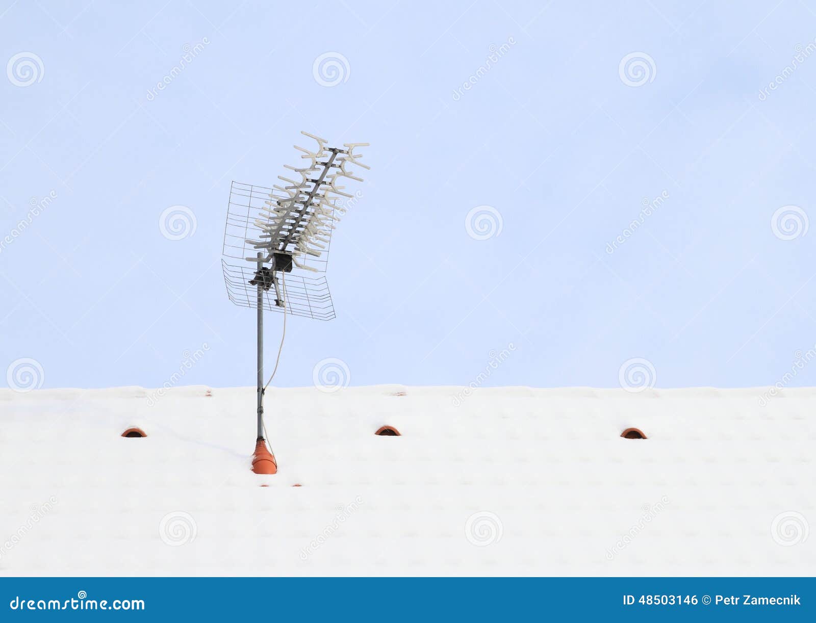 antena on roof covered with snow