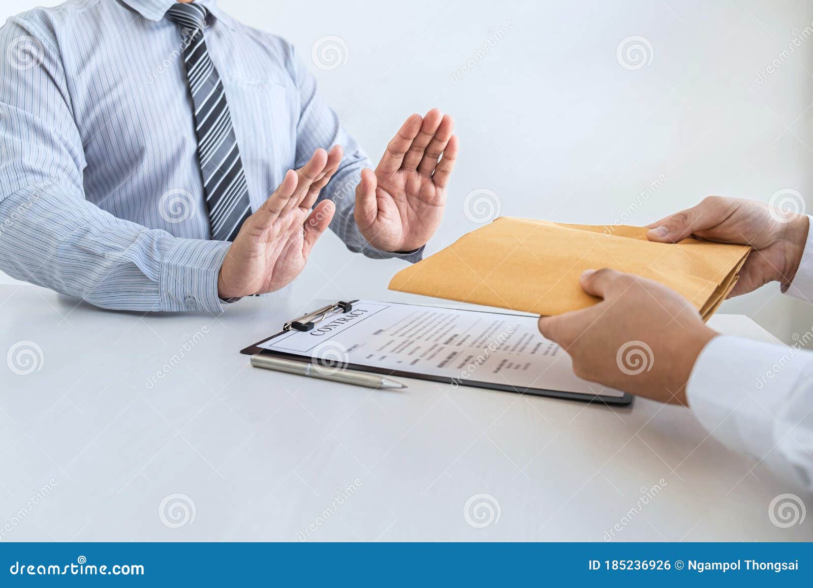 anti bribery and corruption concept, business man refusing and don`t receive money banknote in envelope offer from business peopl