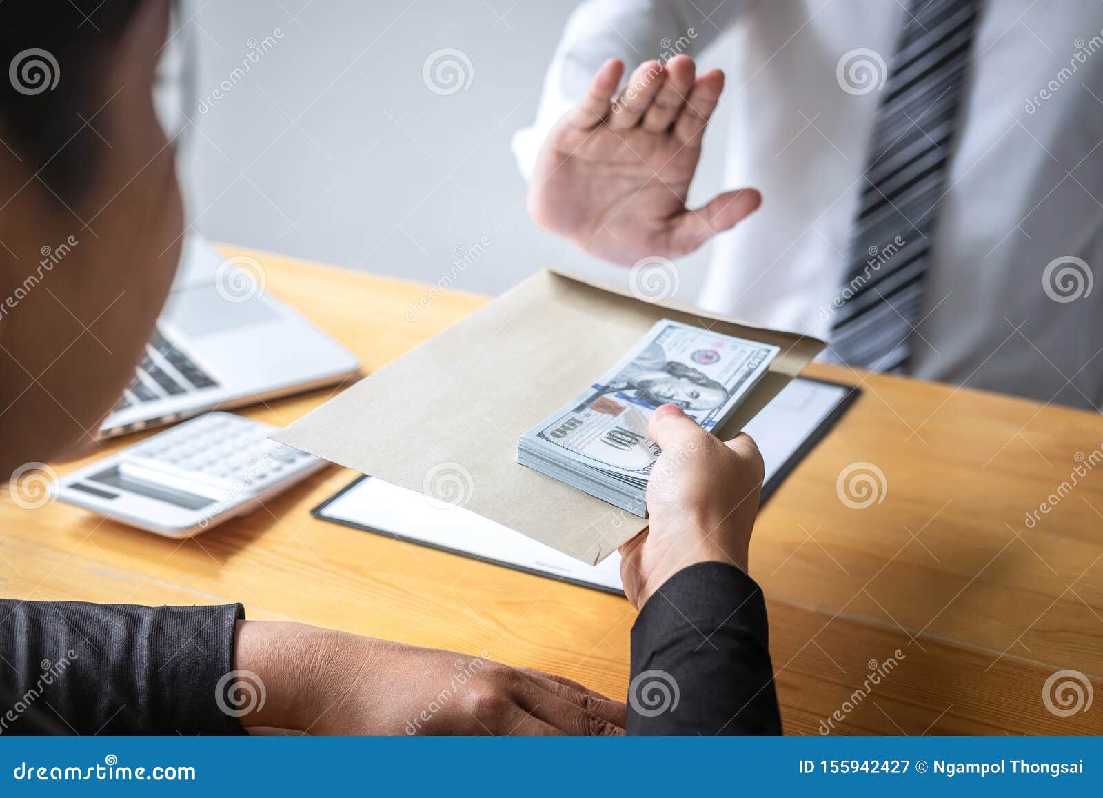 anti bribery and corruption concept, business man refusing and don`t receive money banknote in envelope offer from business peopl