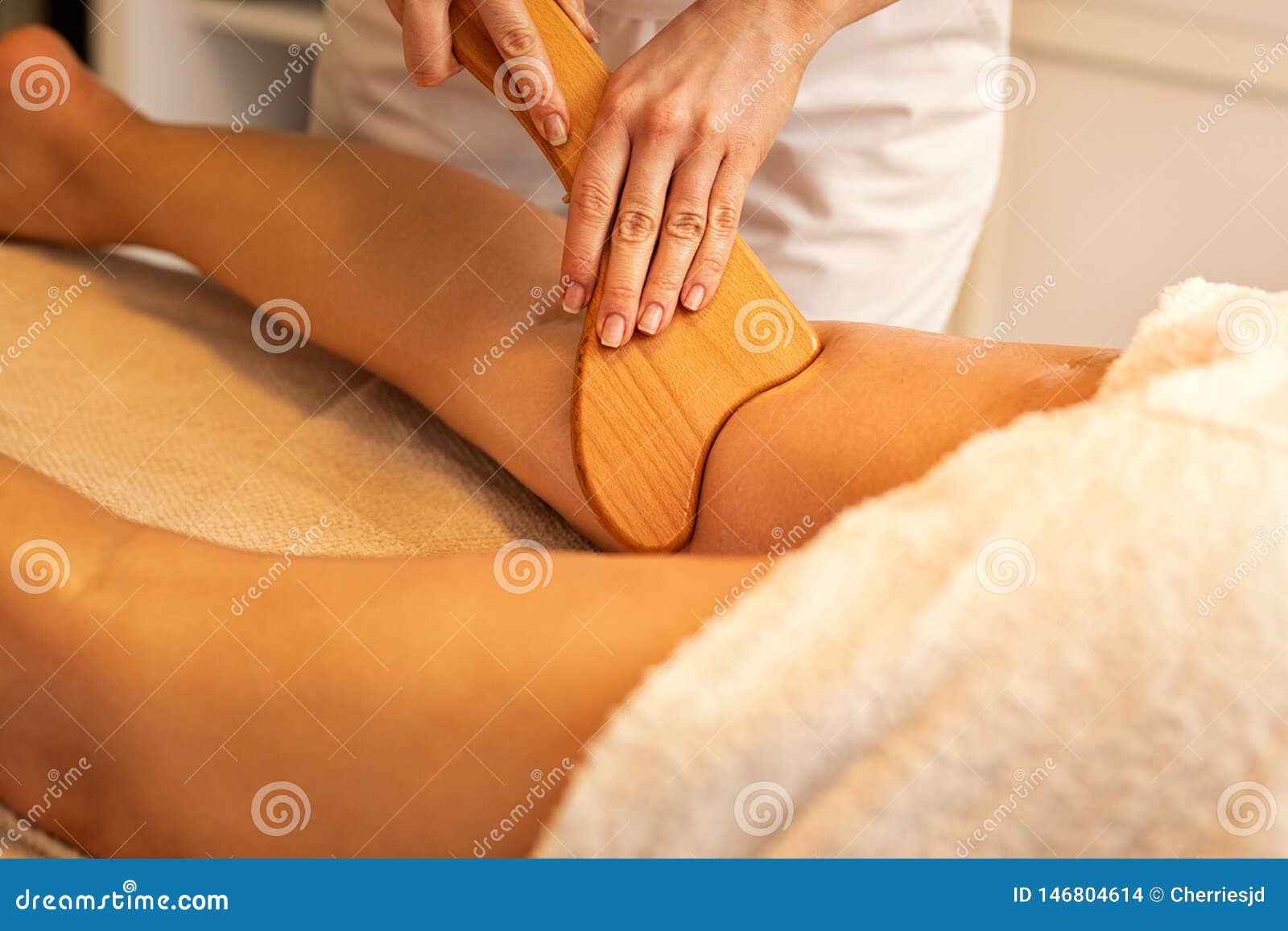 anti-cellulite madero therapy massage done with specially ed wooden tool
