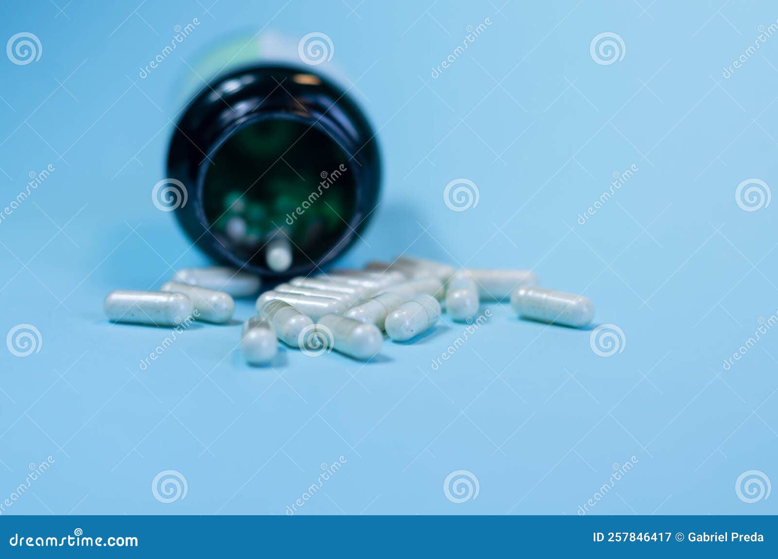 Antidepressant Drugs Meds, Capsule and Pills on Blue Background Stock