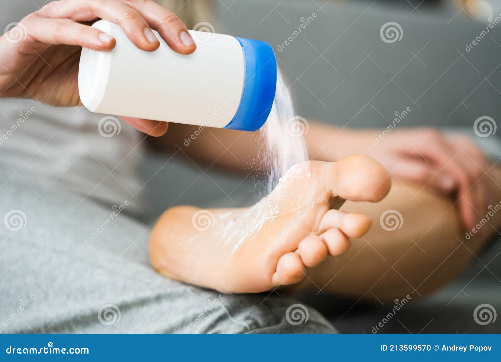 antifungal talcum powder on foot. feet fungus