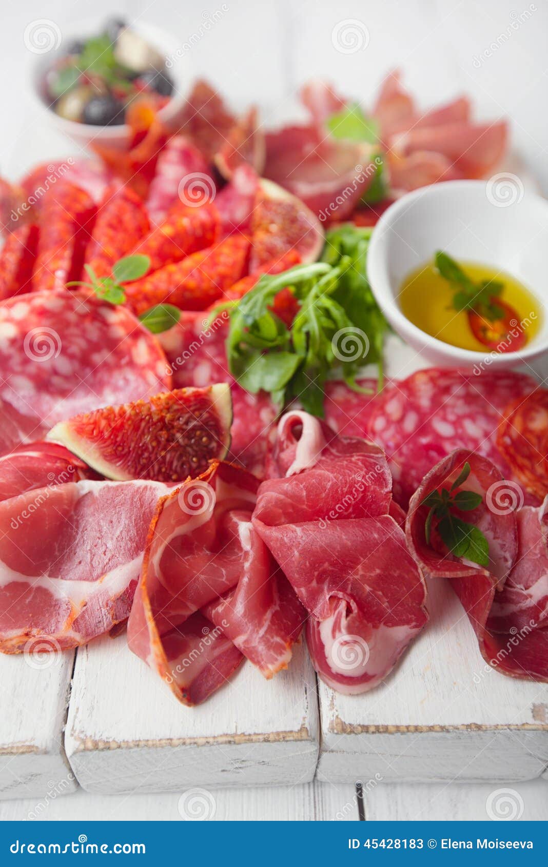 antipasti platter of cured meat, jamon, sausage, salame on whi