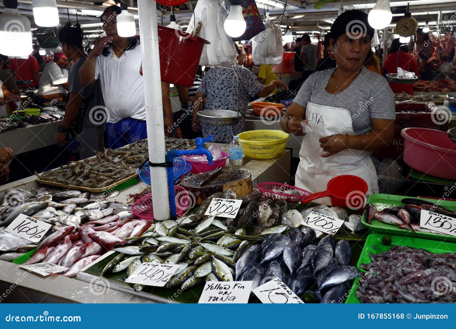 Vendors at a Public Wet Market Sell Fish and Other Seafood To Customers ...