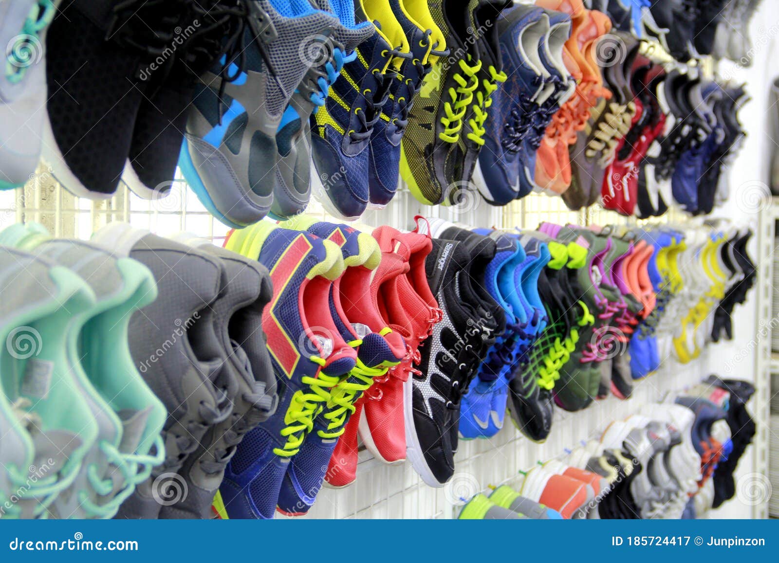 Assorted Used Rubber Shoes on Display at a Used Clothing and Cookware ...