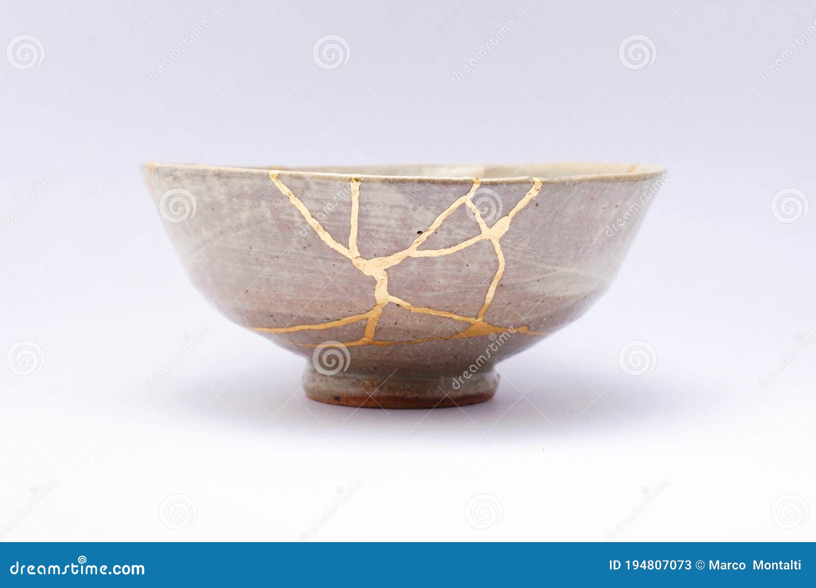 antique beautiful bowl restored with kintsugi gold technique