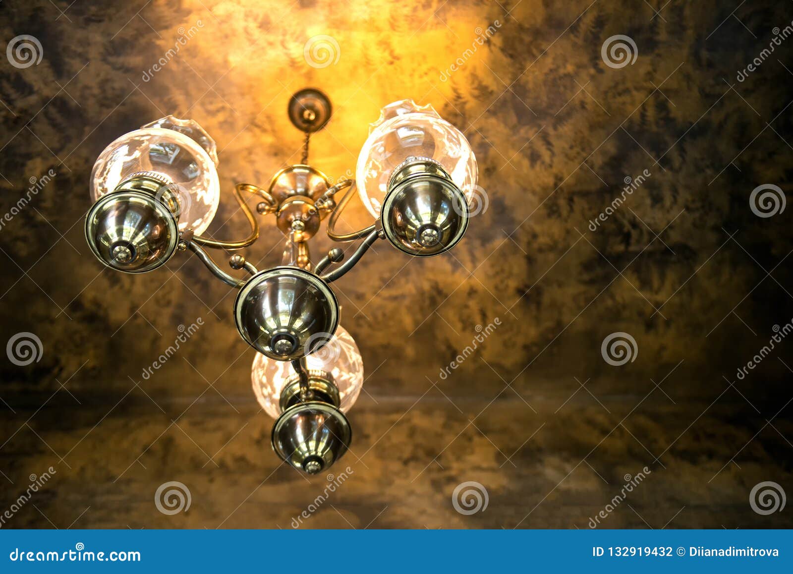 Antique chandelier on a dark vintage background - selective focus, space for text